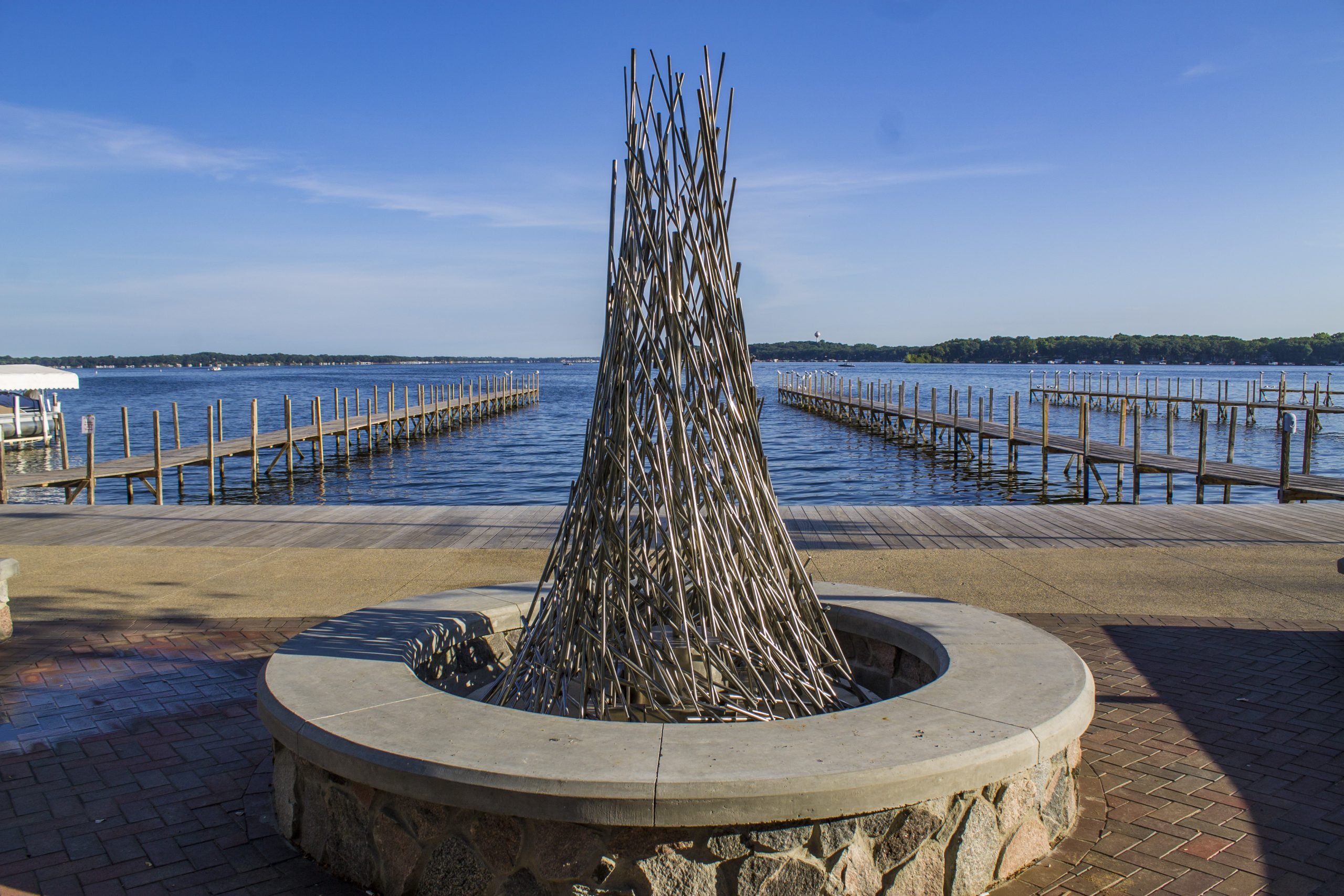 Sculpture at the Arnolds Park State Pier & Boardwalk on a sunny day featuring Kebony Modified Wood Clear Boardwalk Decking in Arnolds Park, Indiana