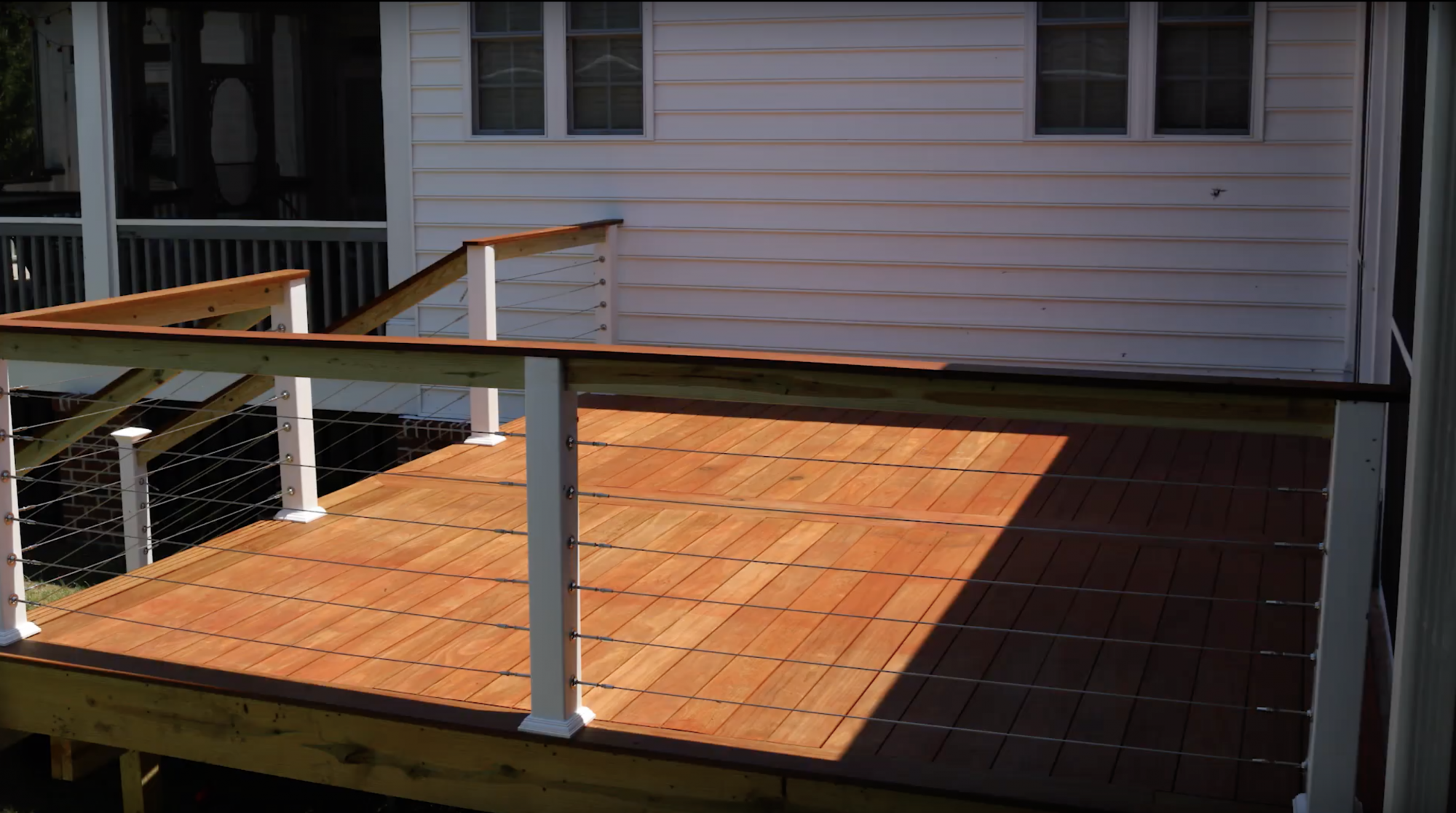 Sunny view of a deck featuring Kebony Modified Wood Deck Boards