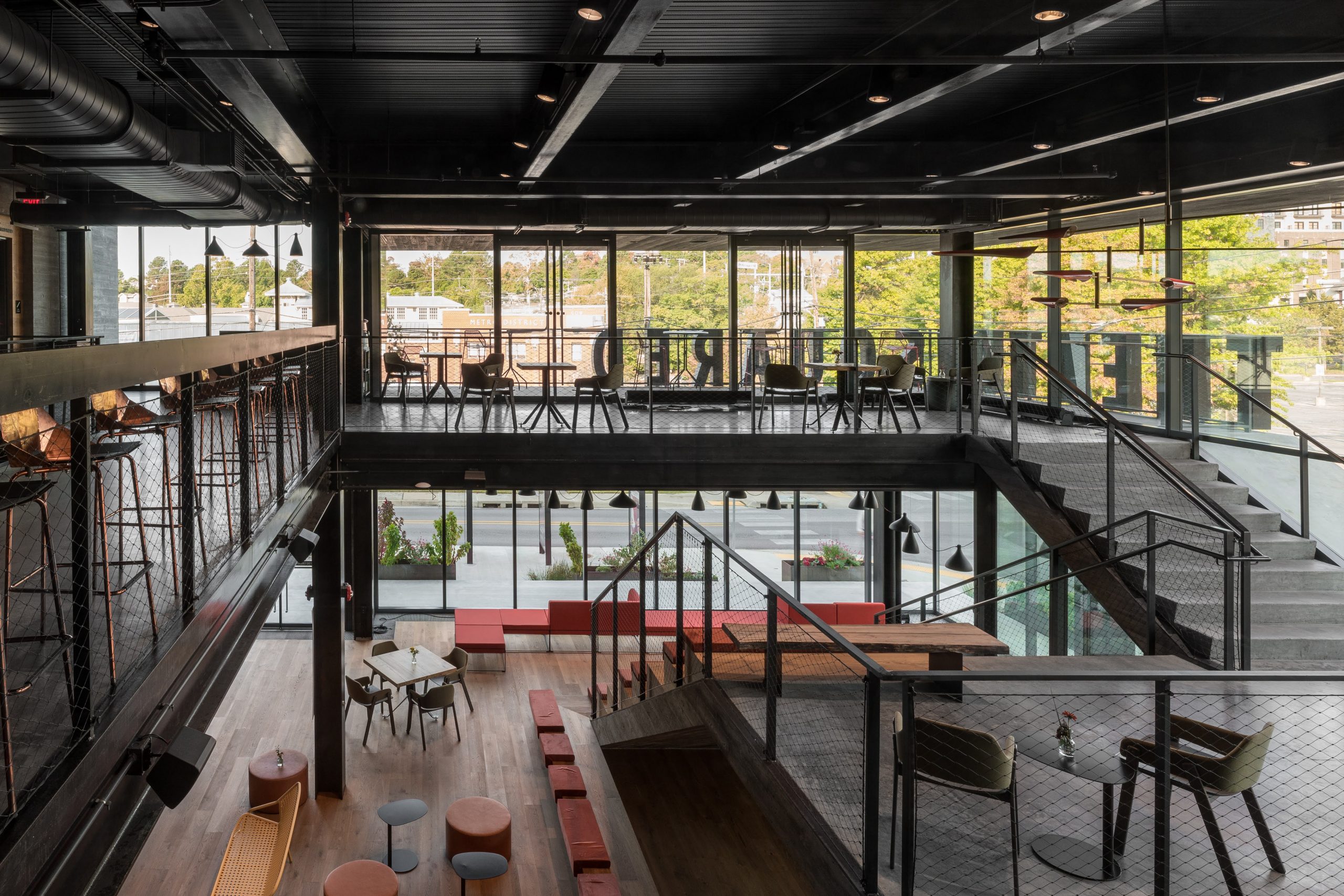 Inside the modern interior on the second floor are areas surrounded by lavish furnishings of Theatre Squared professional theatre in Fayetteville, Arkansas featuring Kebony Clear Cladding with a Shou Sugi Ban Half Gator Finish