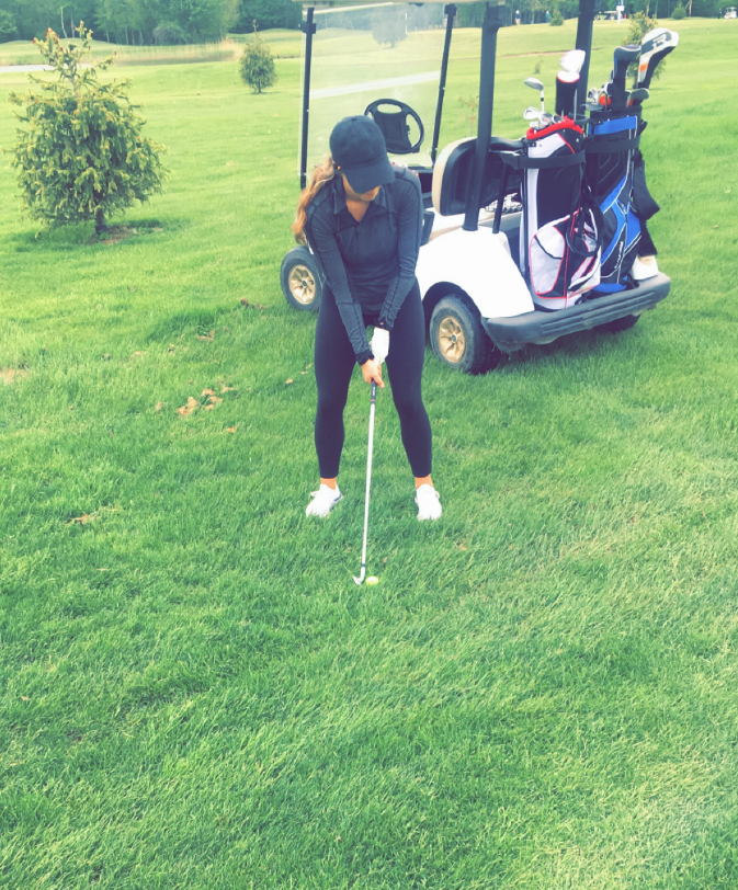 Haley Bacarella, a Kebony Modified Wood Business Development Specialist, tees up for some golfing on a sunny day