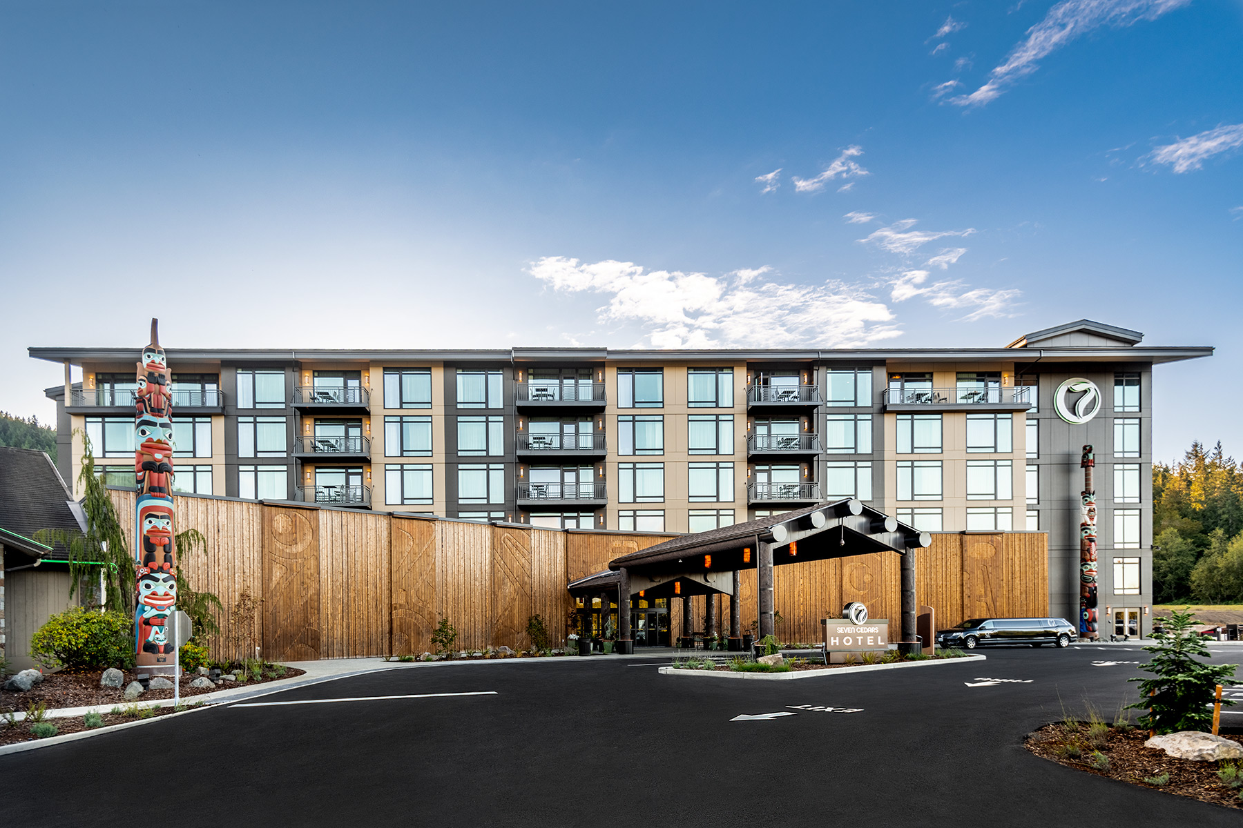 Outside view of the entrance to the 7 Cedars Resort Hotel Casino in Sequim, Washington featuring Kebony modified wood Clear and Character Cladding at sunrise
