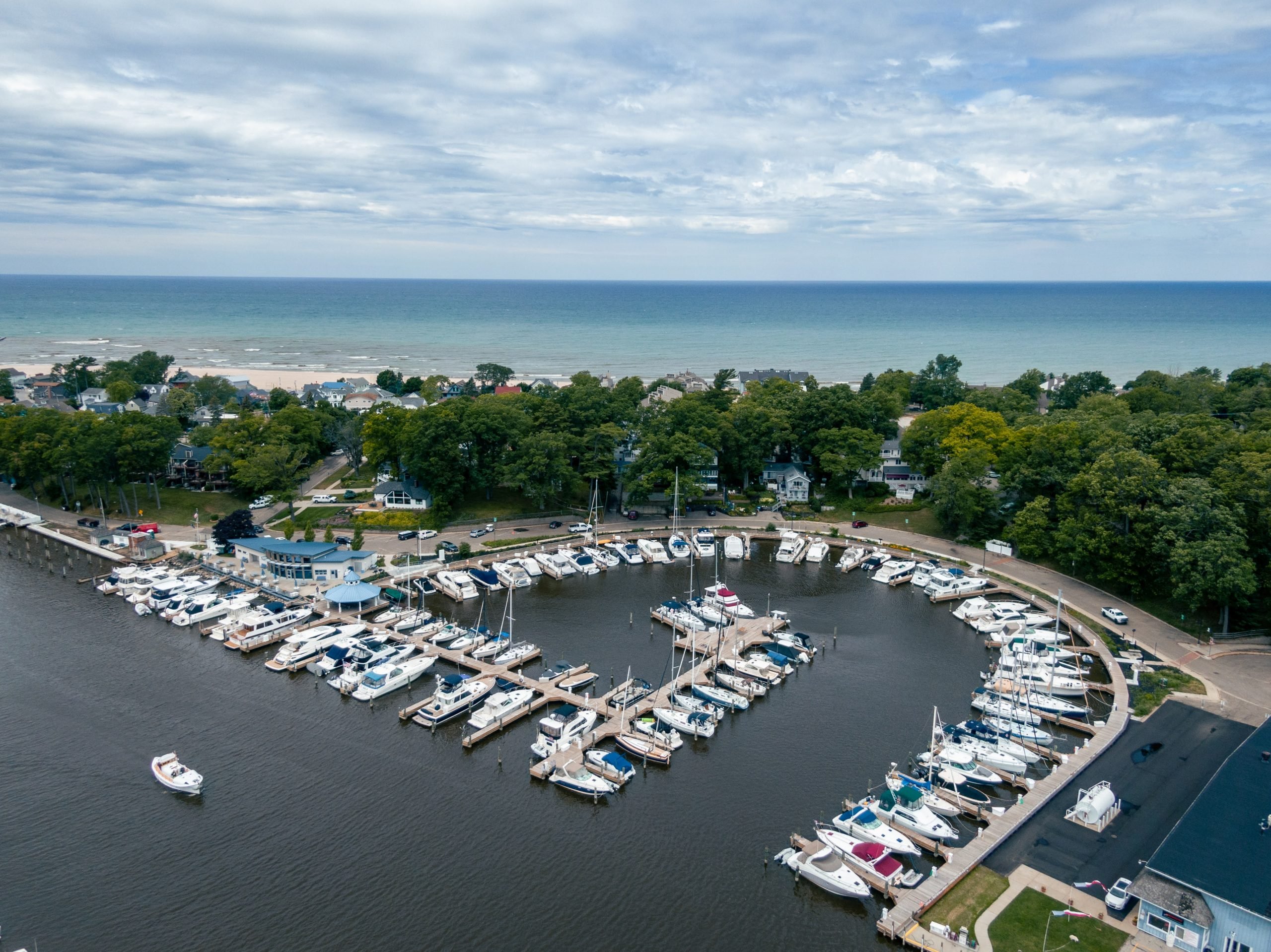 Arial view of most of the boats docked on the Black River at South Haven Municipal Marina in South Haven Michigan featuring Kebony modified clear wood decking