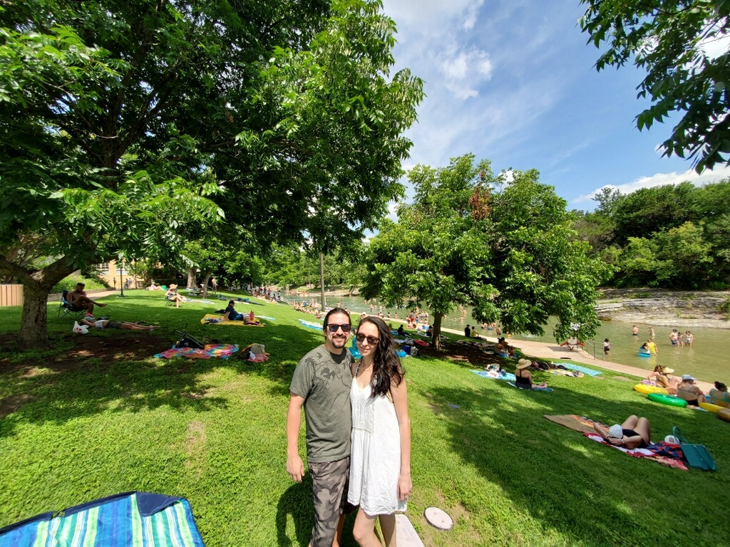 Judy Andrade, Business Development Specialist at Kebony, and fiancé enjoy the summer sun at an outdoor swimming pool